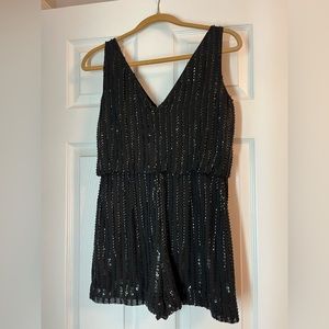 BRAND: Adrianna Papell SIZE: 2. Black romper with sequins. NEVER WORN